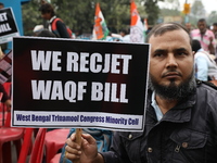 Activists from The All India Trinamool Congress take part in a protest meeting in Kolkata, India, on November 30, 2024, demanding the withdr...