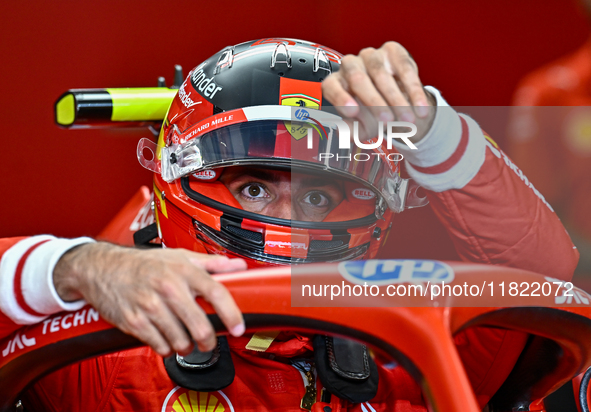 Spanish driver Carlos Sainz of Ferrari prepares to drive during the first practice session of the Formula 1 Grand Prix of Qatar at Lusail In...