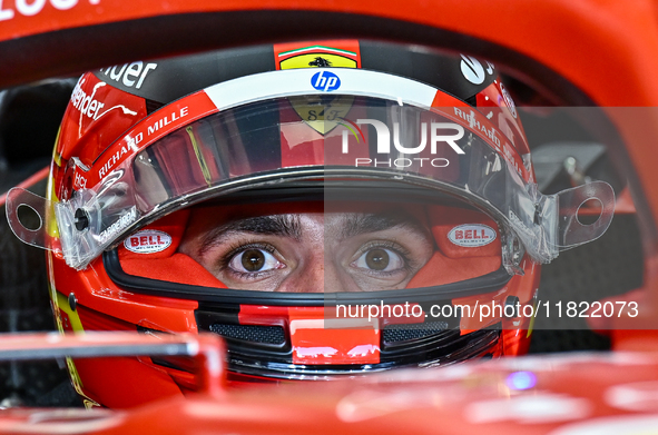 Spanish driver Carlos Sainz of Ferrari prepares to drive during the first practice session of the Formula 1 Grand Prix of Qatar at Lusail In...