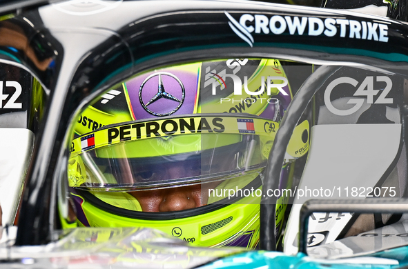 British driver Lewis Hamilton of Mercedes prepares to drive during the first practice session of the Formula 1 Grand Prix of Qatar at Lusail...