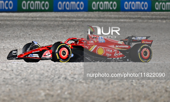 Spanish Formula One driver Carlos Sainz of Ferrari participates in the first practice session of the Formula 1 Grand Prix of Qatar at Lusail...