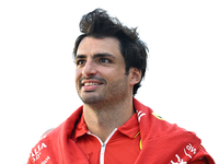 Spanish Formula One driver Carlos Sainz of Ferrari walks through the paddock as he arrives ahead of the Formula 1 Grand Prix of Qatar at Lus...