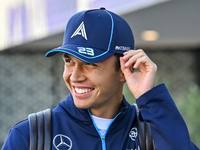 Thai Formula One driver Alexander Albon of Williams walks through the paddock as he arrives ahead of the Formula 1 Grand Prix of Qatar at Lu...