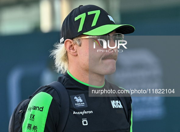 Finnish Formula One driver Valtteri Bottas of Kick Sauber walks through the paddock as he arrives ahead of the Formula 1 Grand Prix of Qatar...