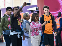 Australian Formula One driver Oscar Piastri of McLaren walks through the paddock as he arrives ahead of the Formula 1 Grand Prix of Qatar at...