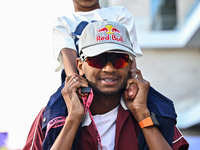 Mutaz Essa Barsham, the Qatari high jump Olympic champion, arrives with his son Yousef ahead of the Formula 1 Grand Prix of Qatar at Lusail...