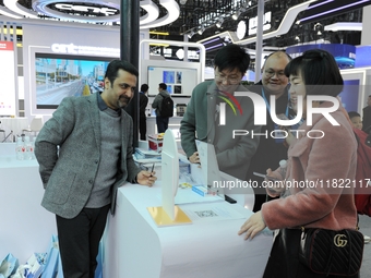 Visitors experience the 2024 Quantum Technology and Industry Conference in Hefei, China, on November 30, 2024. (