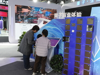 Visitors have a quantum blind box experience at the 2024 Quantum Technology and Industry Conference in Hefei, China, on November 30, 2024. (