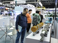 Visitors learn about quantum computing interconnect modules at the 2024 Quantum Technology and Industry Conference in Hefei, China, on Novem...