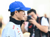 Japanese Formula One driver Yuki Tsunoda of RB walks through the paddock as he arrives ahead of the Formula 1 Grand Prix of Qatar at Lusail...