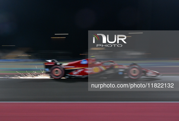 Spanish driver Carlos Sainz of Ferrari participates in the first practice session of the Formula 1 Grand Prix of Qatar at Lusail Internation...