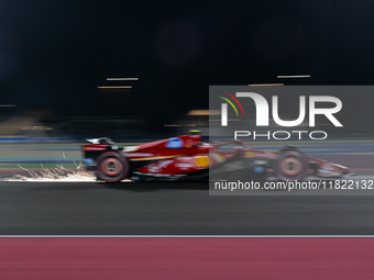 Spanish driver Carlos Sainz of Ferrari participates in the first practice session of the Formula 1 Grand Prix of Qatar at Lusail Internation...