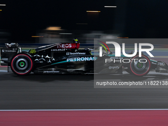 British driver Lewis Hamilton of Mercedes participates in the first practice session of the Formula 1 Grand Prix of Qatar at Lusail Internat...