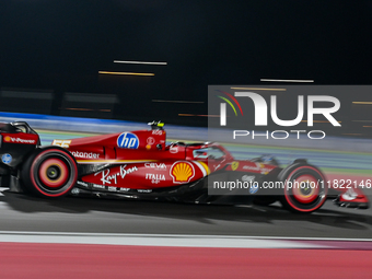 Spanish driver Carlos Sainz of Ferrari participates in the first practice session of the Formula 1 Grand Prix of Qatar at Lusail Internation...