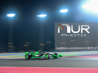 Chinese driver Zhou Guanyu of Alfa Romeo Ferrari participates in the first practice session of the Formula 1 Grand Prix of Qatar at Lusail I...