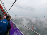 A man looks at the city of Colombo amid smog and rain from Lotus Tower in Colombo, Sri Lanka, on November 30, 2024. Sri Lanka's Central Envi...