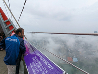 A man looks at the city of Colombo amid smog and rain from Lotus Tower in Colombo, Sri Lanka, on November 30, 2024. Sri Lanka's Central Envi...