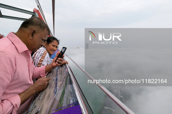 People look at the city of Colombo amid smog and rain from Lotus Tower in Colombo, Sri Lanka, on November 30, 2024. Sri Lanka's Central Envi...