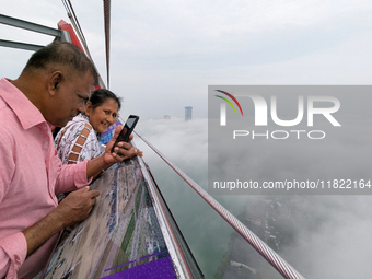 People look at the city of Colombo amid smog and rain from Lotus Tower in Colombo, Sri Lanka, on November 30, 2024. Sri Lanka's Central Envi...