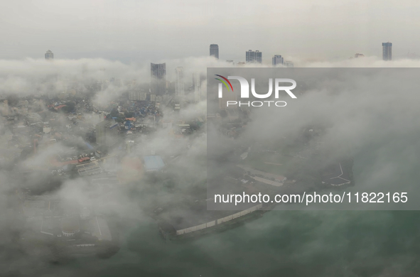 The city of Colombo is seen amid smog and rain from Lotus Tower in Colombo, Sri Lanka, on November 30, 2024. Sri Lanka's Central Environment...