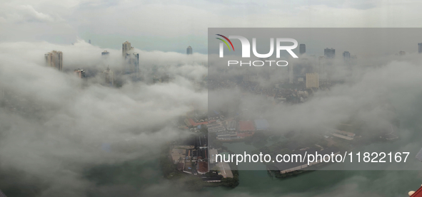 The city of Colombo is seen amid smog and rain from Lotus Tower in Colombo, Sri Lanka, on November 30, 2024. Sri Lanka's Central Environment...