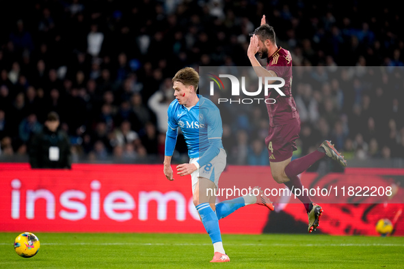 Scott McTominay of SSC Napoli and Bryan Cristante of AS Roma compete for the ball during the serie Serie A Enilive match between SSC Napoli...