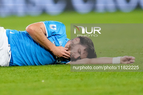 Khvicha Kvaratskhelia of SSC Napoli lies injured on the pitch during the serie Serie A Enilive match between SSC Napoli and AS Roma at Stadi...