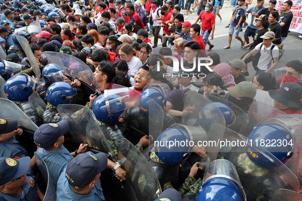 Militant Groups Clash With Anti-riot Police During A Protest In Commemorating The 161st Birth Anniversary Of Gat. Andres Bonifacio In Manila...