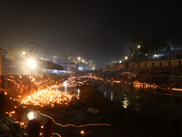 A long exposure shot shows lights set to float in the Bagmati River by Hindu devotees in Kathmandu, Nepal, on November 30, 2024, during the...