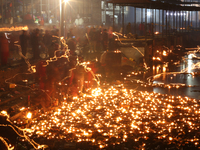 A long exposure shot shows lights set to float in the Bagmati River by Hindu devotees in Kathmandu, Nepal, on November 30, 2024, during the...