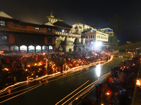 A long exposure shot shows lights set to float in the Bagmati River by Hindu devotees in Kathmandu, Nepal, on November 30, 2024, during the...