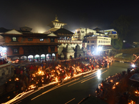 A long exposure shot shows lights set to float in the Bagmati River by Hindu devotees in Kathmandu, Nepal, on November 30, 2024, during the...