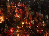 Nepali Hindu devotees light oil-fed lamps on the embankment of the Bagmati River in Kathmandu, Nepal, on November 30, 2024, on the occasion...