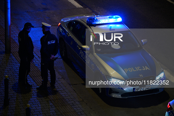 Members of the Ostatnie Pokolenie or Last Generation group block traffic on the Wybrzeze Gdanskie street in Warsaw, Poland on 27 November, 2...