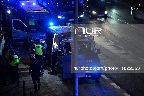 Members of the Ostatnie Pokolenie or Last Generation group block traffic on the Wybrzeze Gdanskie street in Warsaw, Poland on 27 November, 2...