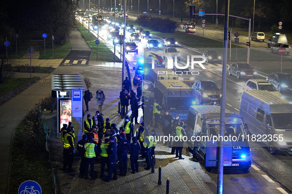 Members of the Ostatnie Pokolenie or Last Generation group block traffic on the Wybrzeze Gdanskie street in Warsaw, Poland on 27 November, 2...