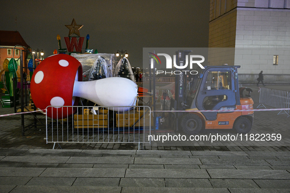 A large mushroom sculpture is seen as part of Christmas decorations being built up in Warsaw, Poland on 27 November, 2024. 