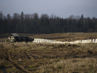 Anti-tank concrete fortifications are pictured at the Polish-Russian border as members of the Polish armed forces stand guard in Dabrowka, P...