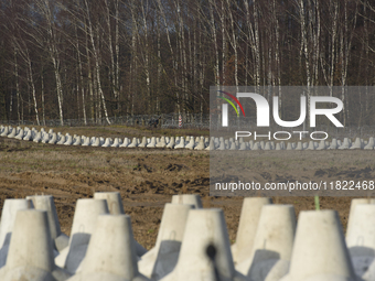 Anti-tank concrete fortifications are pictured at the Polish-Russian border in Dabrowka, Poland, on November 30, 2024. The East Shield progr...