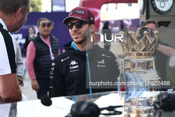 Pierre Gasly of Alpine and Premier League Trophy before Sprint ahead of the Formula 1 Grand Prix of Qatar at Lusail International Circuit in...