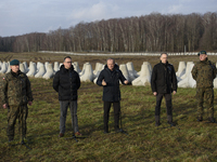 From left to right: Gen. Marek Wawrzyniak, Minister of Infrastructure Dariusz Klimczak, Prime Minister Donald Tusk, Deputy Minister of Natio...