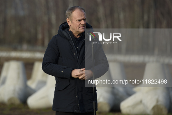 Polish Prime Minister Donald Tusk speaks to the media at the Polish-Russian border in Dabrowka, Poland, on November 30, 2024. The East Shiel...