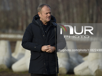 Polish Prime Minister Donald Tusk speaks to the media at the Polish-Russian border in Dabrowka, Poland, on November 30, 2024. The East Shiel...