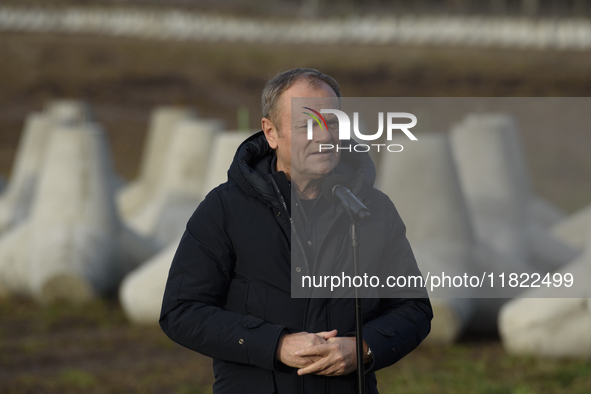 Polish Prime Minister Donald Tusk speaks to the media at the Polish-Russian border in Dabrowka, Poland, on November 30, 2024. The East Shiel...