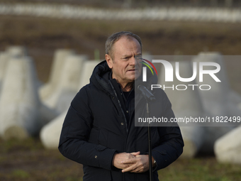 Polish Prime Minister Donald Tusk speaks to the media at the Polish-Russian border in Dabrowka, Poland, on November 30, 2024. The East Shiel...