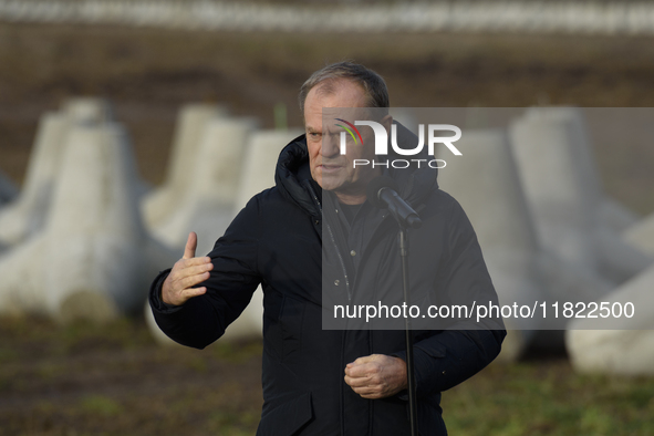 Polish Prime Minister Donald Tusk speaks to the media at the Polish-Russian border in Dabrowka, Poland, on November 30, 2024. The East Shiel...