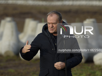 Polish Prime Minister Donald Tusk speaks to the media at the Polish-Russian border in Dabrowka, Poland, on November 30, 2024. The East Shiel...