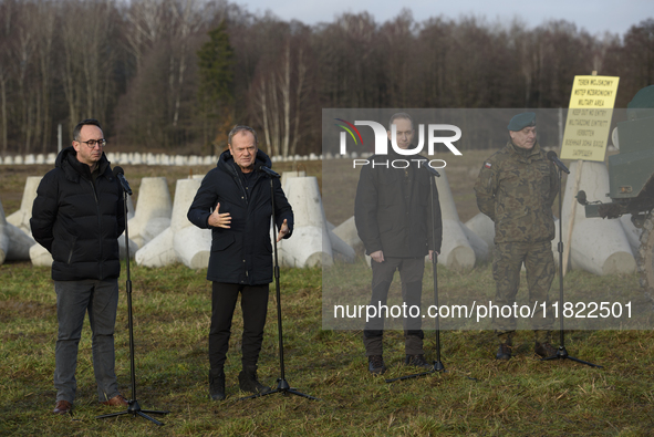 From left to right: Minister of Infrastructure Dariusz Klimczak, Prime Minister Donald Tusk, Deputy Minister of National Defense Cezary Tomc...