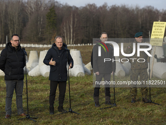 From left to right: Minister of Infrastructure Dariusz Klimczak, Prime Minister Donald Tusk, Deputy Minister of National Defense Cezary Tomc...