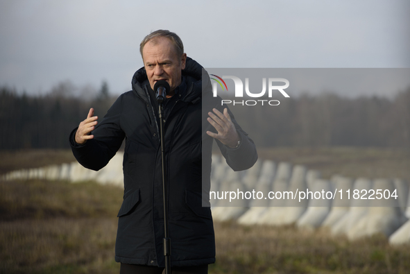 Polish Prime Minister Donald Tusk speaks to the media at the Polish-Russian border in Dabrowka, Poland, on November 30, 2024. The East Shiel...